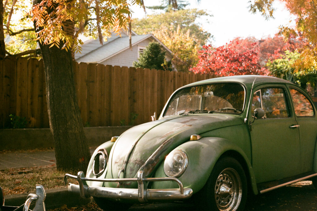 35 mm film photo of vintage volkswagon in the fall