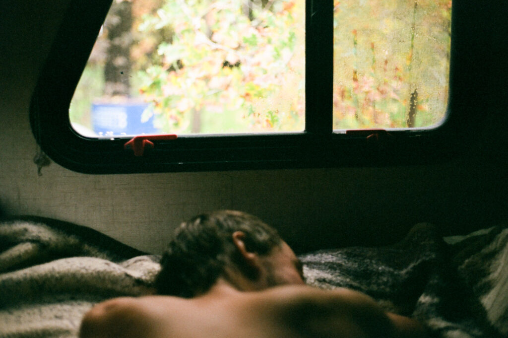 35mm film photo of intimate scene of love interest sleeping